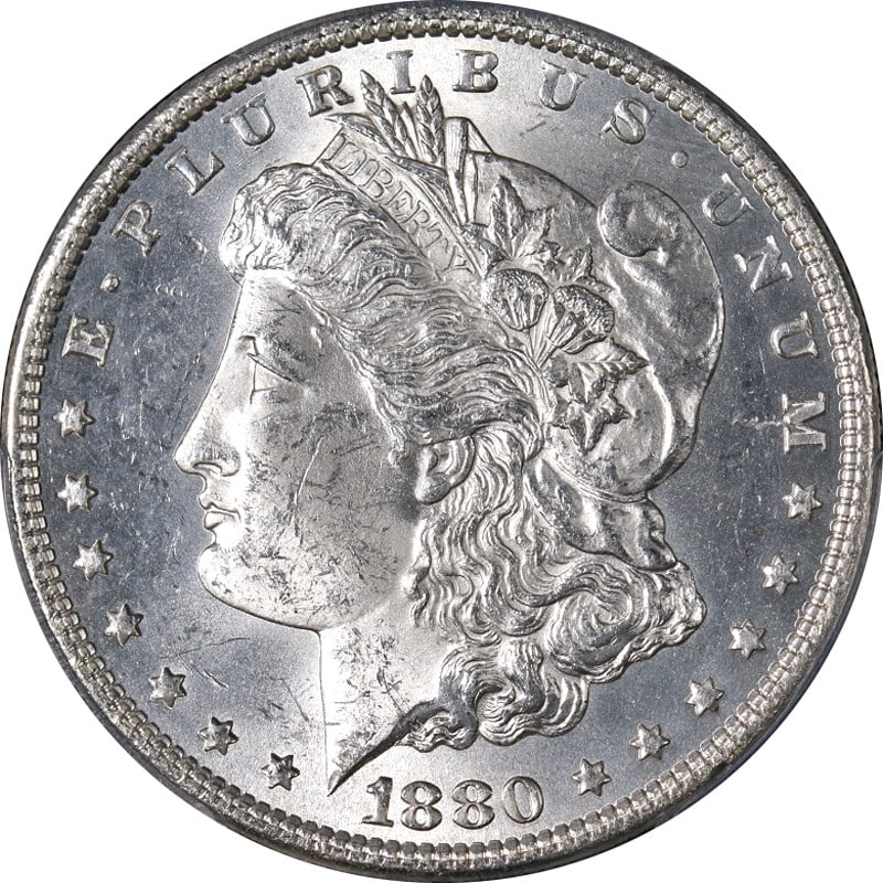 PCGS MS63 1880 Philadelphia Morgan Dollar Silver Coin Blast White Uncirculated: PCGS MS63 1880 Philadelphia Morgan Dollar Silver Coin Blast White Uncirculated This stunning 1880-P Morgan Silver Dollar is certified by PCGS with a grade of MS63, ensuring its uncirculated condition 