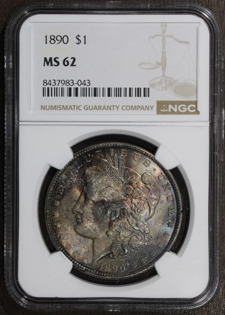 NGC MS62 1890 Morgan Silver Dollar Great Toning: NGC MS62 1890 Morgan Silver Dollar Great Toning This 1890 Morgan Silver Dollar is graded MS62 by NGC and features attractive toning. Struck in Philadelphia, the coin is composed of 0.9 fine silver and