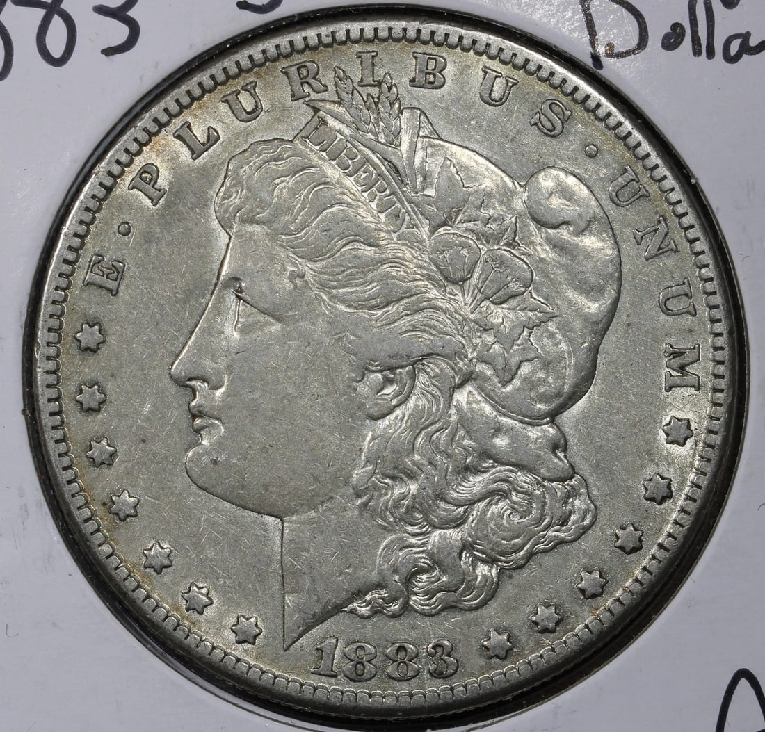 1883 San Francisco Morgan Silver Dollar AU: 1883 San Francisco Morgan Silver Dollar AU This is an 1883 Morgan Silver Dollar from the San Francisco Mint. The coin is composed of 90% silver and is in lightly circulated condition, showing signs of