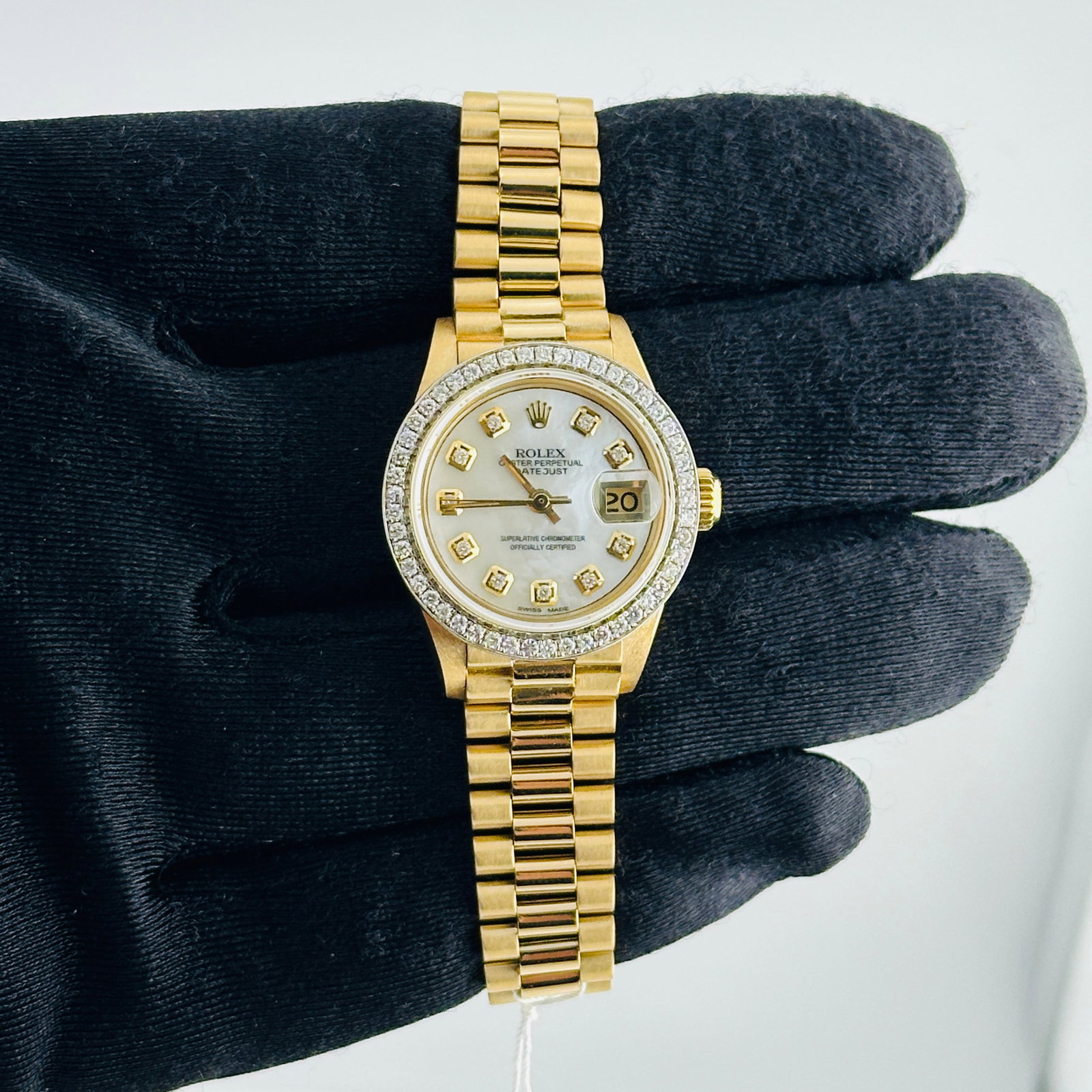 Rolex Ladies President Bracelet Datejust Ref 6917 Aftermarket Diamond MOP Dial Watch: Rolex Ladies President Bracelet Datejust Ref 6917 Aftermarket Diamond MOP Dial Watch This ladies Rolex Datejust features a white mother-of-pearl diamond dial and a pave 10K diamond bezel. The watch is
