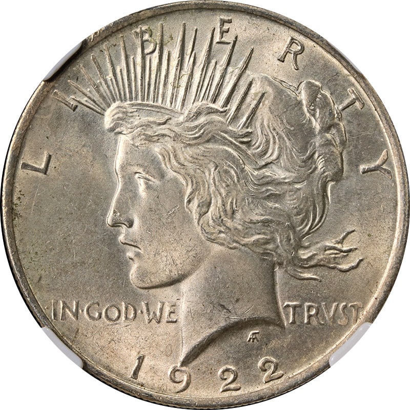 1922 Peace Silver Dollar NGC MS63 With Attractive Toning: 1922 Peace Silver Dollar NGC MS63 With Attractive Toning This 1922-P Peace Dollar is graded MS63 by NGC and features attractive toning. Struck in silver with a fineness of 0.9, this uncirculated coin 