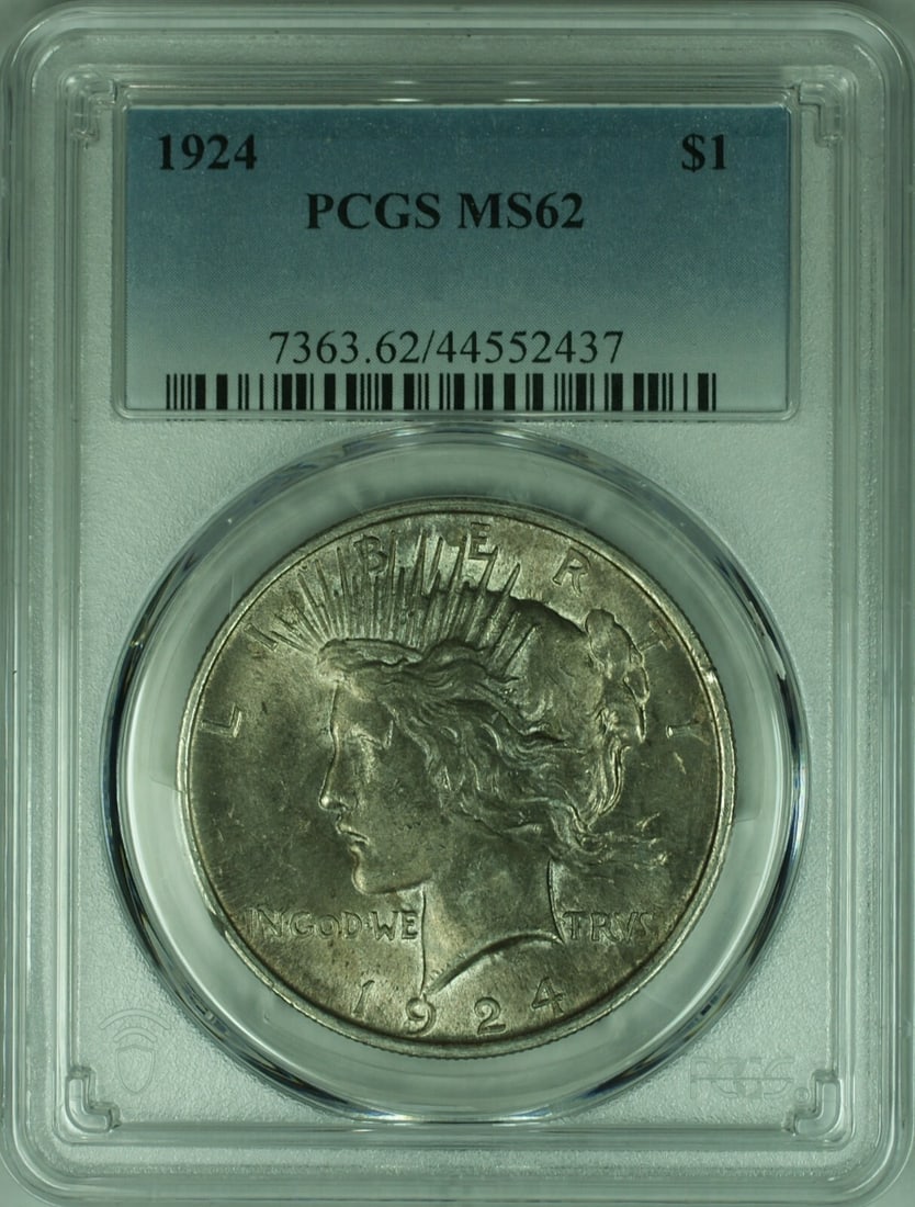 1924 Philadelphia Peace Dollar Silver Coin PCGS MS62 With Toning: 1924 Philadelphia Peace Dollar Silver Coin PCGS MS62 With Toning This is a 1924 Peace Silver Dollar from the United States, certified by PCGS with a grade of MS-62. The coin is uncirculated and displa