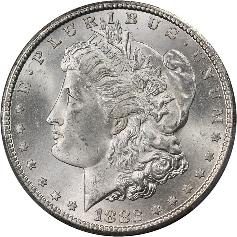 PCGS MS65 1882 CC Morgan Silver Dollar Uncirculated: PCGS MS65 1882 CC Morgan Silver Dollar Uncirculated This 1882-CC Morgan Silver Dollar is graded PCGS MS65 and described as blast white with great eye appeal. It is an uncirculated silver coin from the