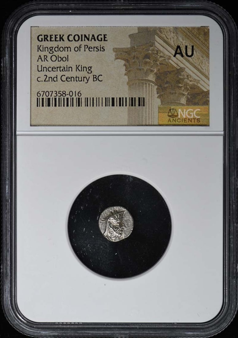 NGC AU50 Kingdom of Persis Ancient Greek AR Obol Coin: NGC AU50 Kingdom of Persis Ancient Greek AR Obol Coin This Kingdom of Persis AR Obol is an ancient Greek coin, certified by NGC with a grade of AU50. It is a pre-owned collectible, originating from Gr