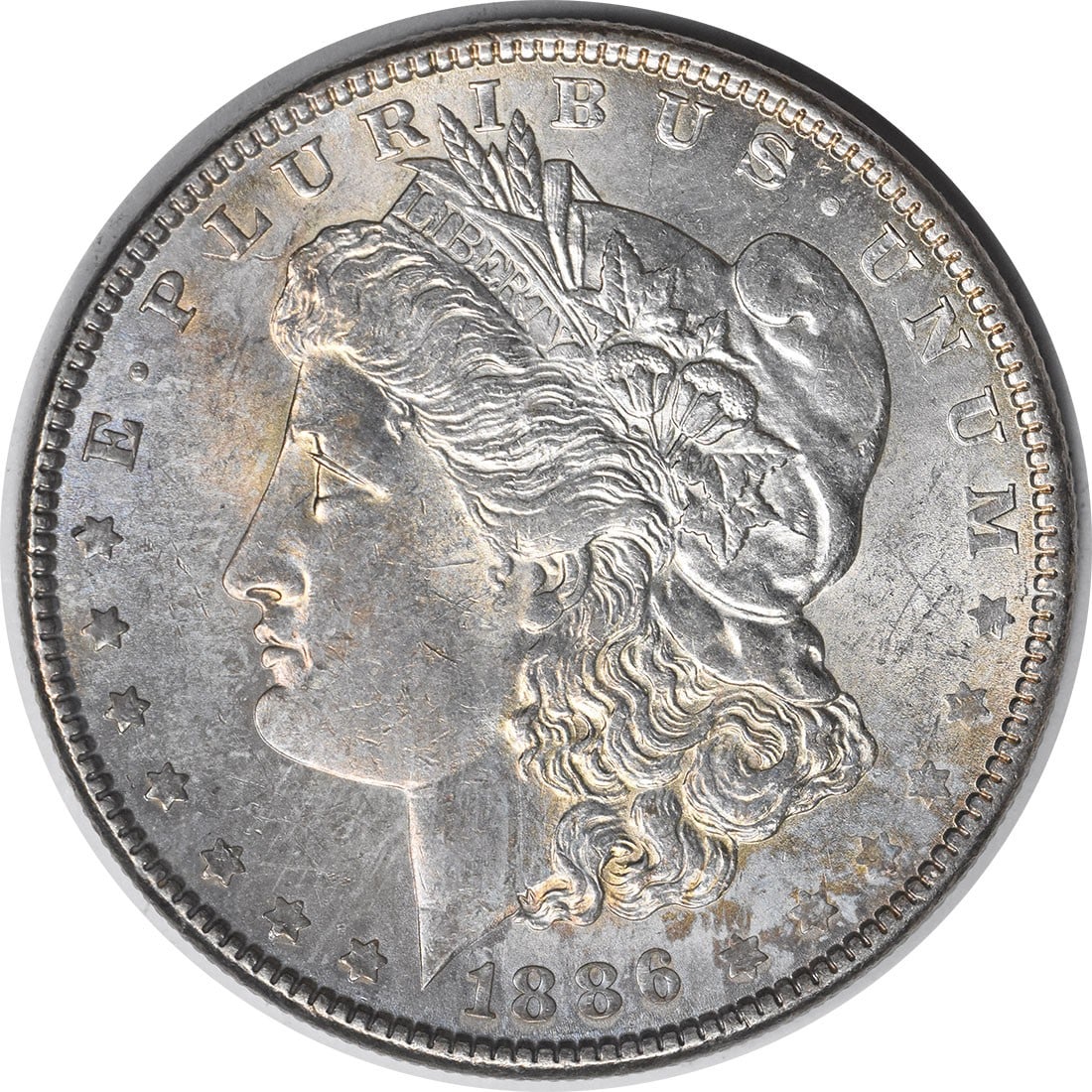 Choice BU 1886 Morgan Dollar Silver Coin Uncirculated Toned Uncertified: Choice BU 1886 Morgan Dollar Silver Coin Uncirculated Toned Uncertified This 1886 Morgan Silver Dollar is an uncirculated coin with a Choice Brilliant Uncirculated (BU) grade and features attractive t