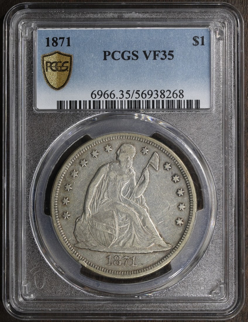 PCGS VF35 1871 United States Seated Liberty Silver Dollar: PCGS VF35 1871 United States Seated Liberty Silver Dollar An 1871 Seated Liberty Dollar graded VF35 by PCGS. This pre-owned United States coin is a $1 silver issue with the With Motto variety and was 
