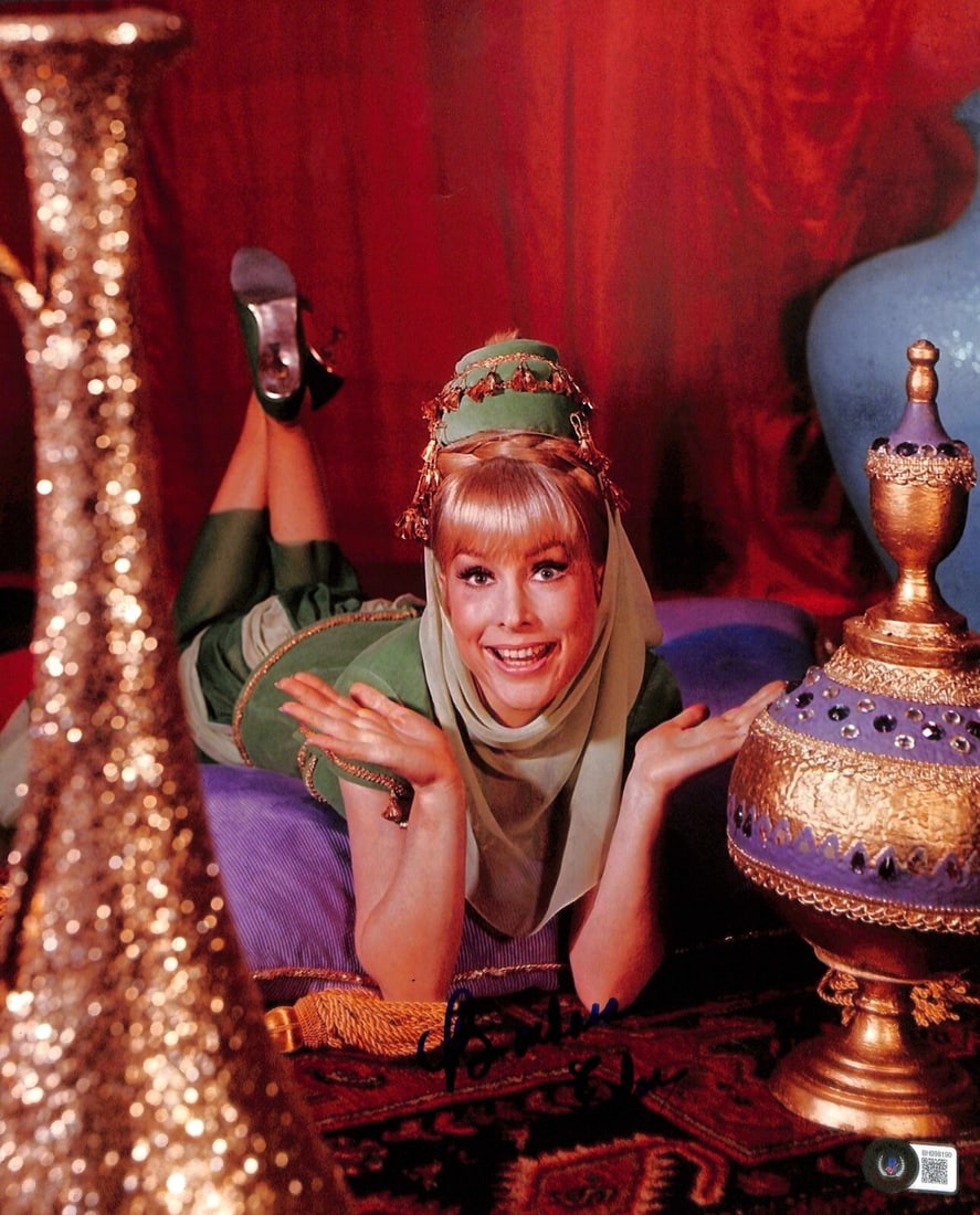 Barbara Eden signed 11x14 I Dream of Jeannie photo Beckett: Barbara Eden signed 11x14 I Dream of Jeannie photo Beckett This 11x14 photograph features Barbara Eden as seen in "I Dream of Jeannie" and is signed and inscribed by the actress in dark blue permanent