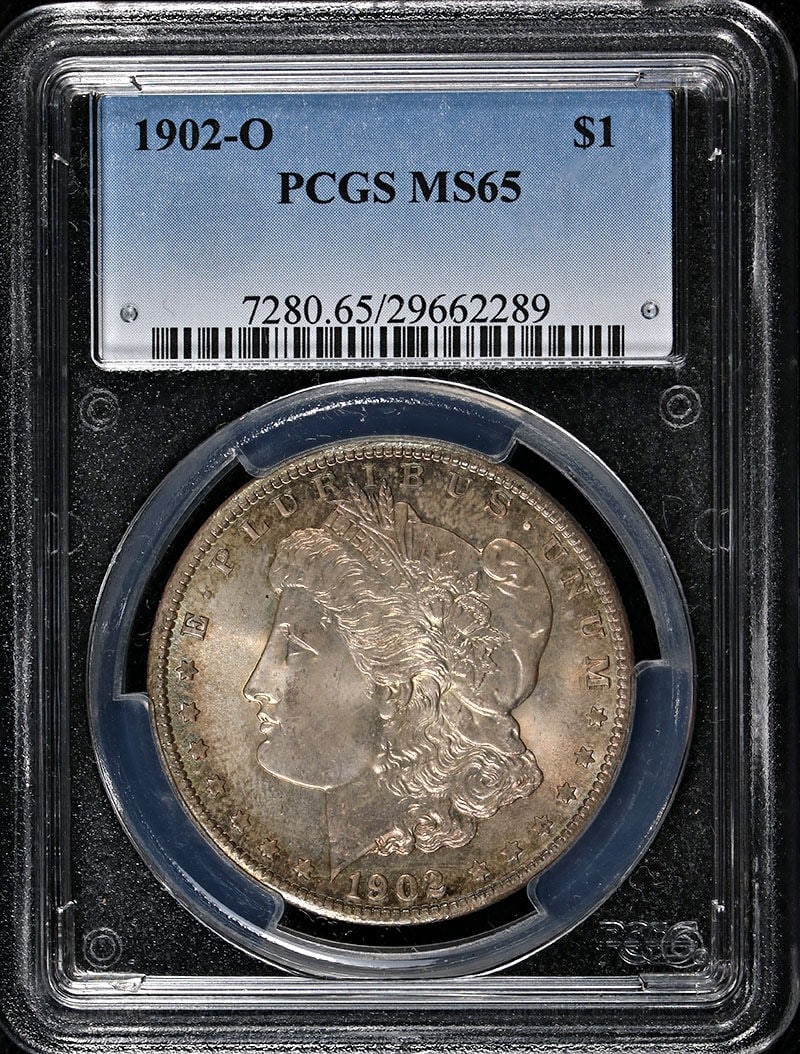 PCGS MS65 1902-O Silver Morgan Dollar With Attractive Toning: PCGS MS65 1902-O Silver Morgan Dollar With Attractive Toning This 1902-O Morgan Silver Dollar is graded MS65 by PCGS and features attractive toning. Struck in 1902 at the New Orleans Mint, this uncirc