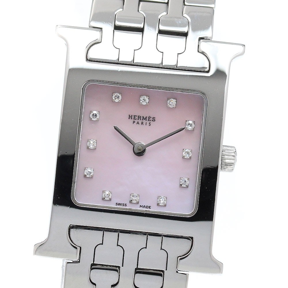Hermes HH1.210 H-Watch womens quartz wristwatch with 12 diamonds: Hermes HH1.210 H-Watch womens quartz wristwatch with 12 diamonds Hermes HH1.210 H-Watch quartz women's wristwatch in pre-owned condition. The watch is described as Swiss-made and features 12 diamonds.