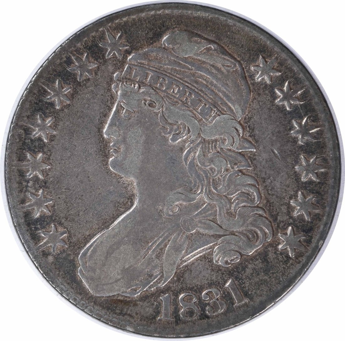 1831 Bust Silver Half Dollar 50C John Reich Design Uncertified: 1831 Bust Silver Half Dollar 50C John Reich Design Uncertified This 1831 Bust Silver Half Dollar is a remarkable piece of numismatic history, featuring a classic design by John Reich. Minted in Philad
