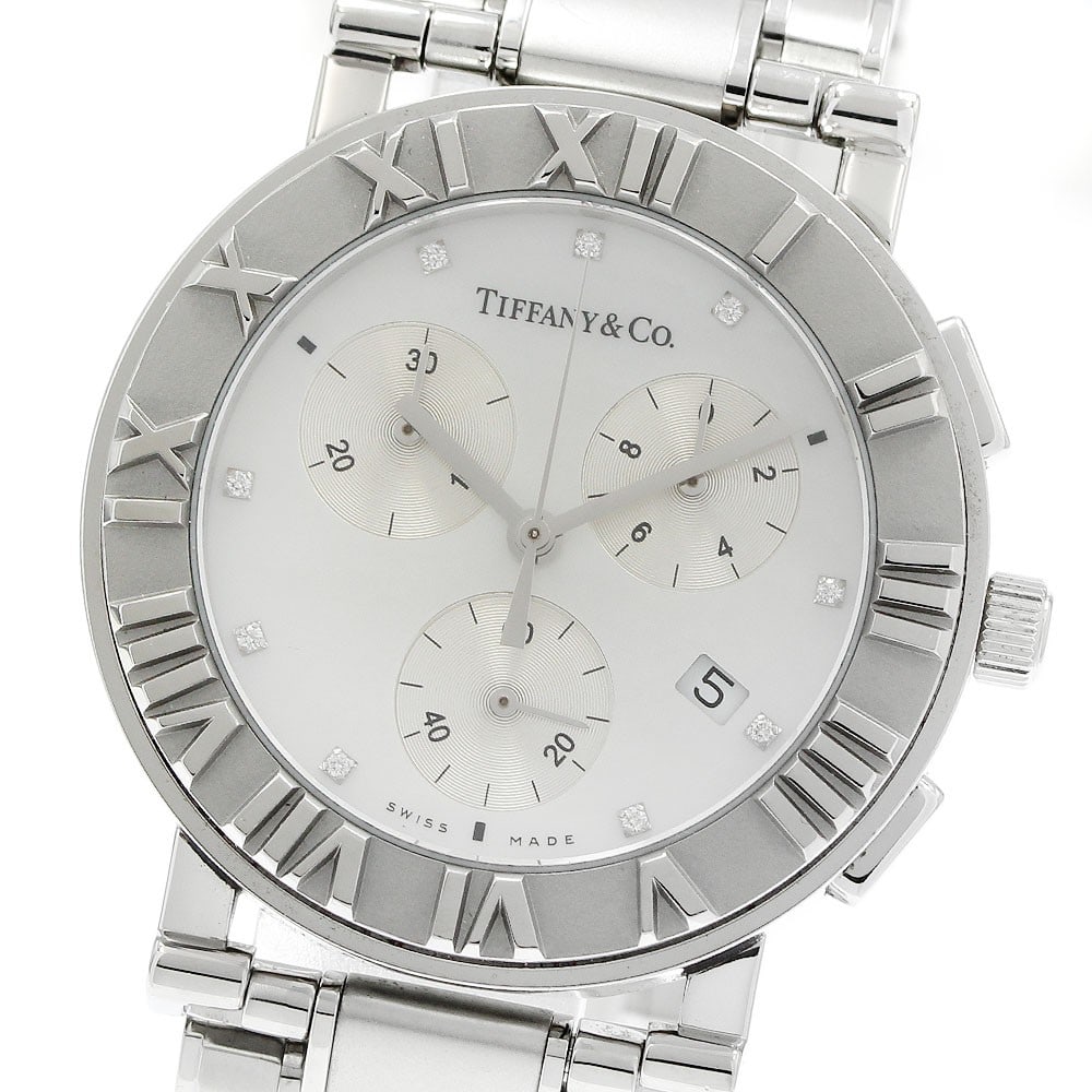 Tiffany Atlas quartz chronograph women's stainless steel watch: Tiffany Atlas quartz chronograph women's stainless steel watch This pre-owned Tiffany & Co. Atlas Chronograph wristwatch is designed for women and features a stainless steel case and bracelet. The wat