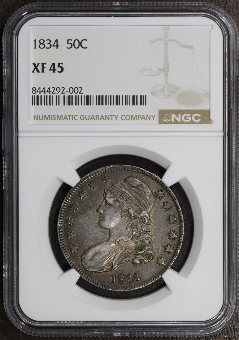 1834 NGC XF45 Capped Bust Silver Half Dollar: 1834 NGC XF45 Capped Bust Silver Half Dollar This 1834 Capped Bust Half Dollar is a circulated silver coin graded XF 45 by NGC. Minted in Philadelphia, it features the classic Capped Bust design and i