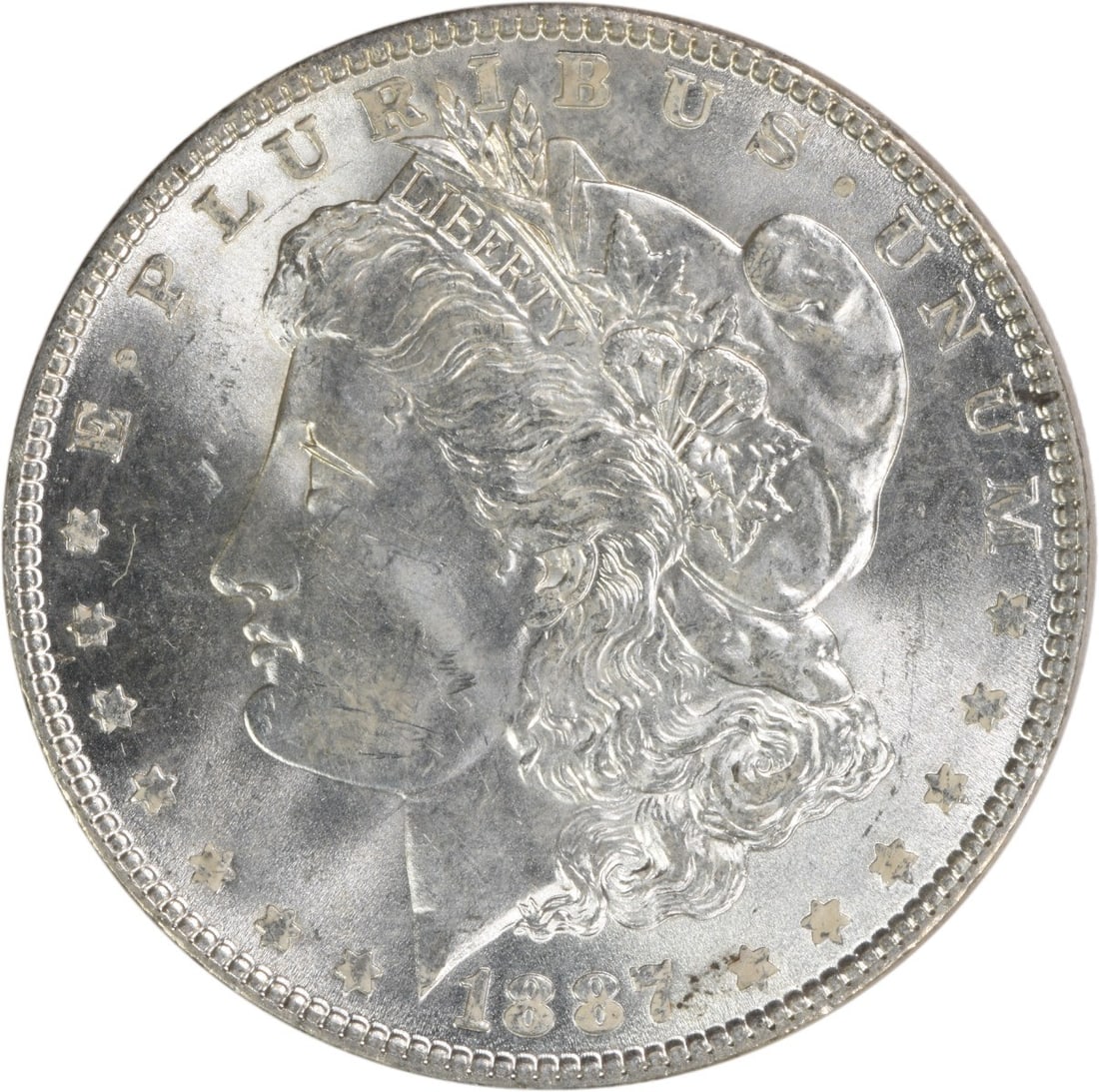 Choice BU 1887 Silver Dollar Morgan Uncirculated Philadelphia No Mint Mark: Choice BU 1887 Silver Dollar Morgan Uncirculated Philadelphia No Mint Mark This 1887 Morgan Silver Dollar is a choice brilliant uncirculated coin from the United States. It is uncertified and features