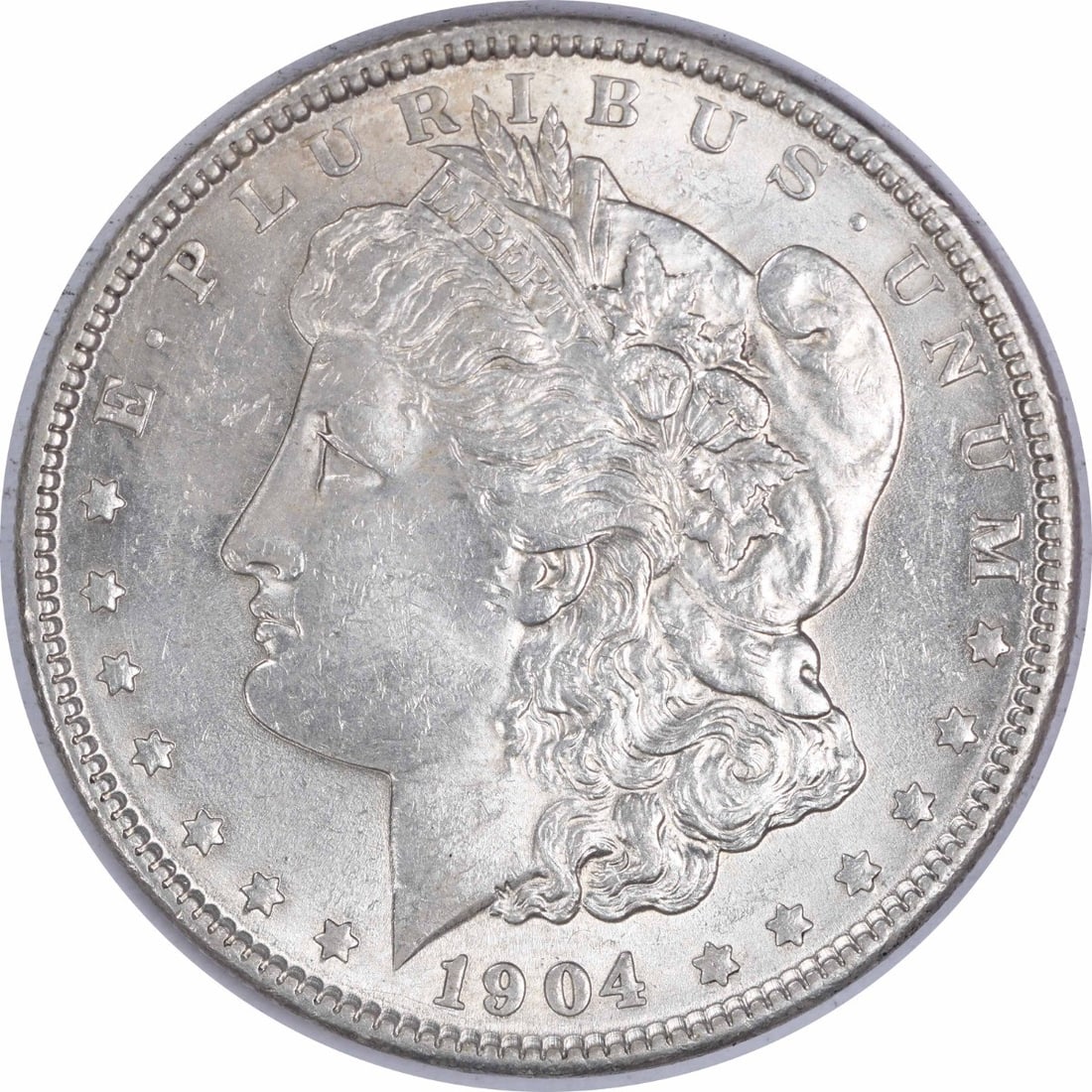 1904 Silver Morgan Dollar Brilliant Uncirculated Uncertified No Mint Mark: 1904 Silver Morgan Dollar Brilliant Uncirculated Uncertified No Mint Mark This 1904 Morgan Silver Dollar is an uncirculated, brilliant uncirculated (BU) coin from the United States. Composed of silver