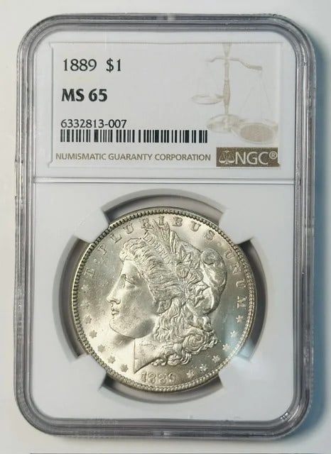 NGC MS 65 1889 Morgan Silver Dollar: NGC MS 65 1889 Morgan Silver Dollar 1889 Morgan Silver Dollar certified by NGC and graded MS 65. This pre-owned U.S. dollar coin is composed of silver and dated 1889. Specifications Certification: NGC