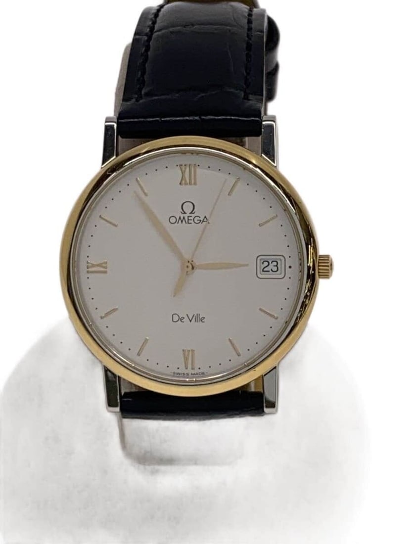 Omega De Ville White Leather Women's Quartz Wristwatch: Omega De Ville White Leather Women's Quartz Wristwatch This OMEGA De Ville Quartz women's wristwatch features a white leather band and a sleek design. Made in Switzerland, the watch displays slight si