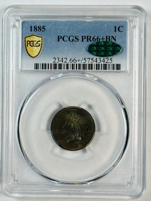 PCGS PR66 Plus Indian Head Cent 1885 Proof Rainbow Toned: PCGS PR66 Plus Indian Head Cent 1885 Proof Rainbow Toned This 1885 Indian Head Cent is a proof coin graded PR-66+ BN by PCGS, featuring remarkable rainbow toning. Struck in copper at the Philadelphia 