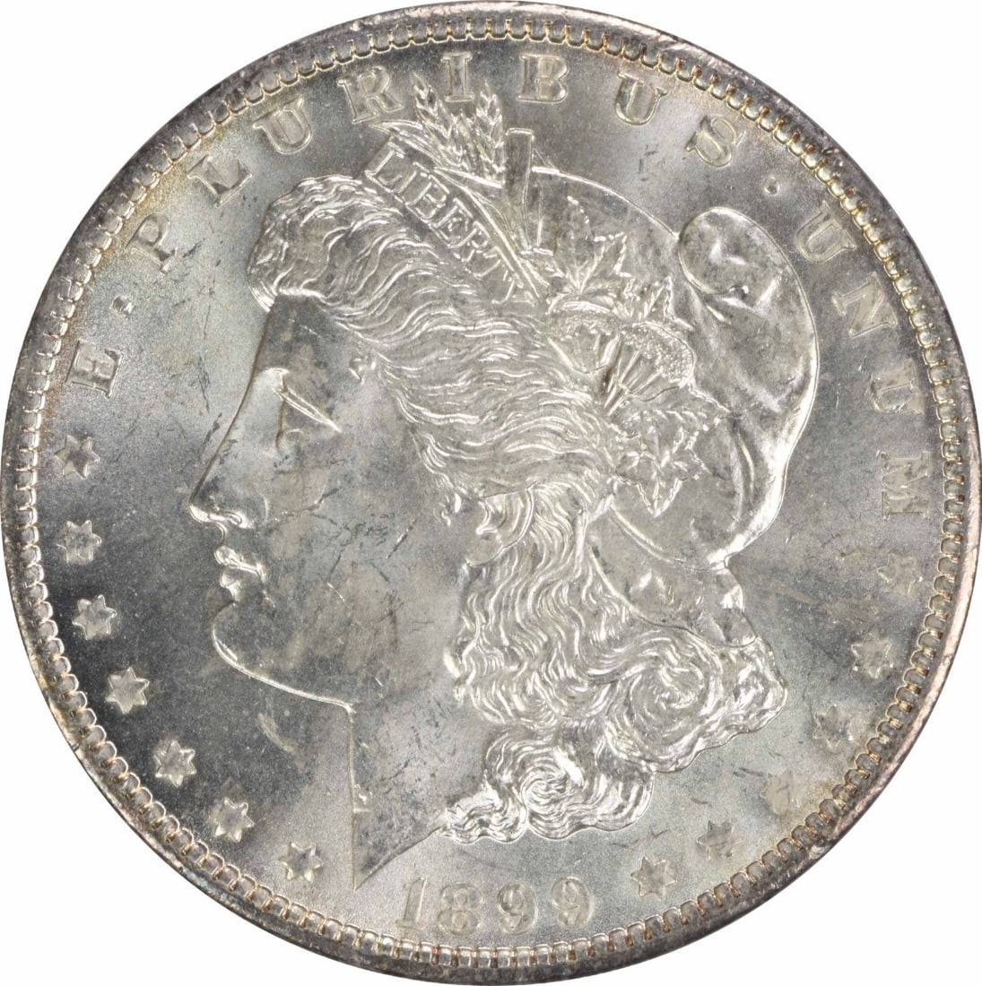 Choice BU 1899 O Silver Morgan Dollar Uncirculated Uncertified Coin: Choice BU 1899 O Silver Morgan Dollar Uncirculated Uncertified Coin This 1899-O Morgan Silver Dollar is a Choice Brilliant Uncirculated (BU) coin from the New Orleans Mint. Composed of silver, it rema