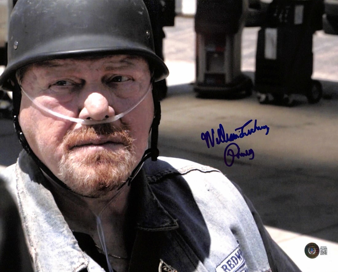William Lucking Sons of Anarchy Signed 11x14 Photo Beckett Certified: William Lucking Sons of Anarchy Signed 11x14 Photo Beckett Certified This stunning 11x14 photograph features a bold blue signature from William Lucking, renowned for his role as "Piney Winston" in the