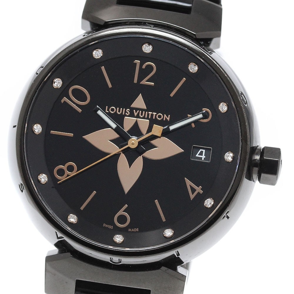 Louis Vuitton Tambour QA048 women's quartz wristwatch: Louis Vuitton Tambour QA048 women's quartz wristwatch This Louis Vuitton Tambour Date quartz women's wristwatch is a pre-owned timepiece made in Switzerland. It is identified as a wristwatch from the 