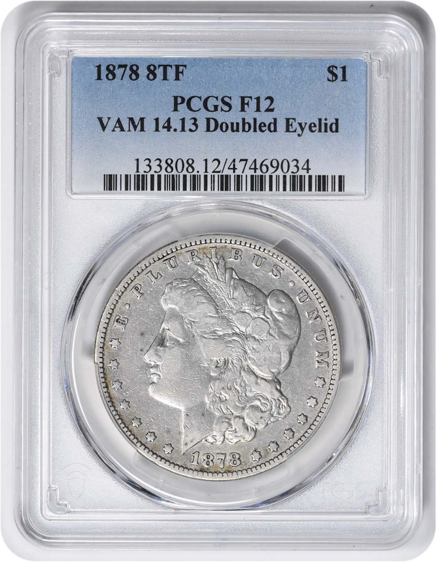 1878 Morgan Silver Dollar Doubled Eyelid F12 PCGS Certified: 1878 Morgan Silver Dollar Doubled Eyelid F12 PCGS Certified This 1878 Morgan Silver Dollar features the Doubled Eyelid variety, certified by PCGS with a grade of F12. Minted in Philadelphia, this coin