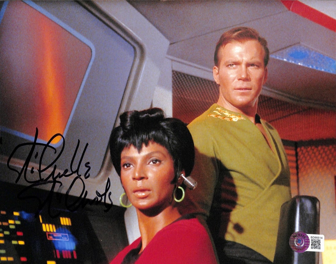 Nichelle Nichols Signed 8x10 Uhura Photo with Captain Kirk Beckett Certified: Nichelle Nichols Signed 8x10 Uhura Photo with Captain Kirk Beckett Certified This remarkable 8x10 color photo features Nichelle Nichols as Lt. Uhura alongside William Shatner as Captain Kirk from Star