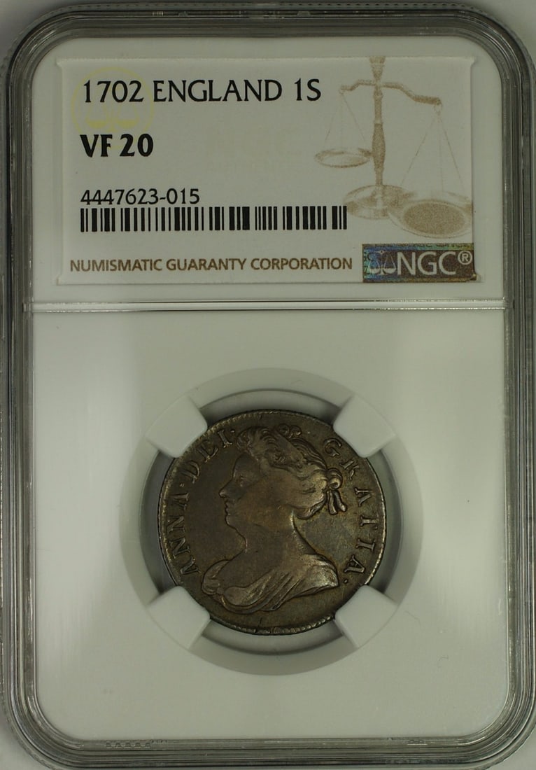 1702 Silver Shilling Coin of Anne England Certified NGC VF-20: 1702 Silver Shilling Coin of Anne England Certified NGC VF-20 This is a 1702 England Anne 1 shilling coin composed of silver. The coin has been graded VF 20 (Very Fine) by NGC and is in circulated, pr