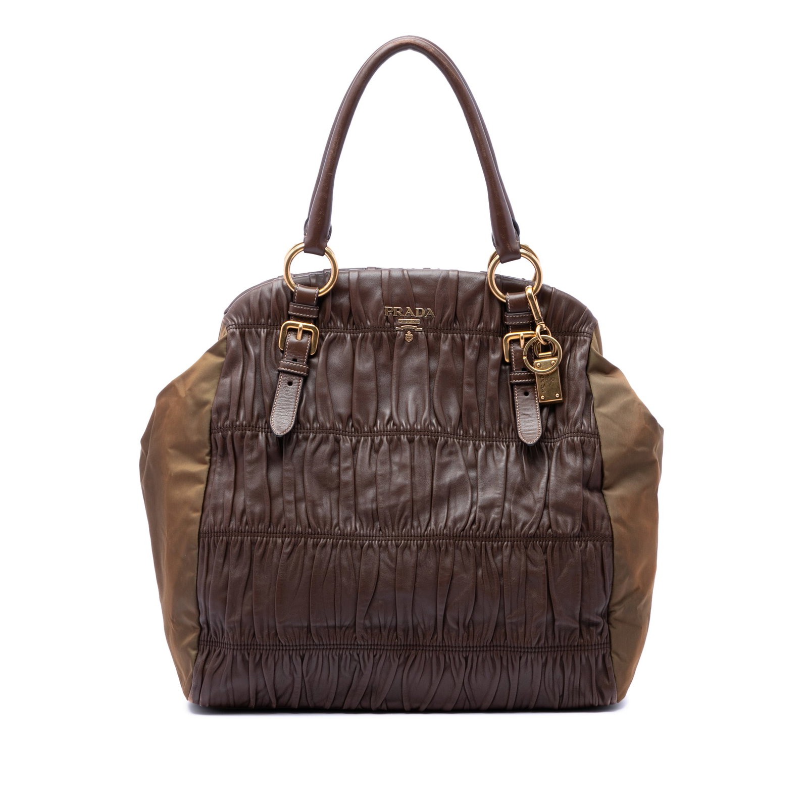 Prada Brown Leather and Nylon Tote Nappa Gaufre Tessuto: Prada Brown Leather and Nylon Tote Nappa Gaufre Tessuto Prada Nappa Gaufre and Tessuto tote in brown, crafted with a gathered nappa leather and nylon body. This tote features rolled leather straps, an