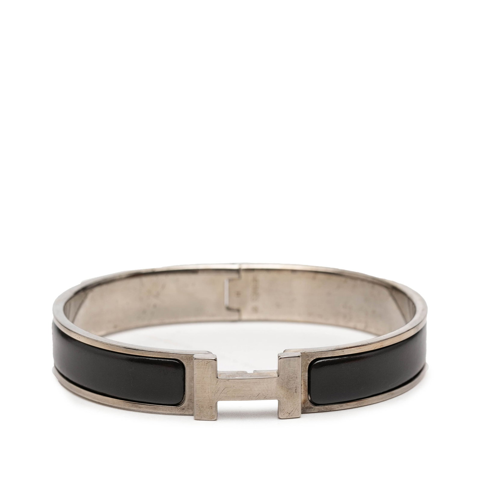 Hermes Clic H PM Narrow Enamel Bracelet: Hermes Clic H PM Narrow Enamel Bracelet Hermes Narrow Enamel Clic H Bracelet PM with a black enamel body, silver-tone metal accents, and the signature H toggle clasp closure. Made in France. Includes 