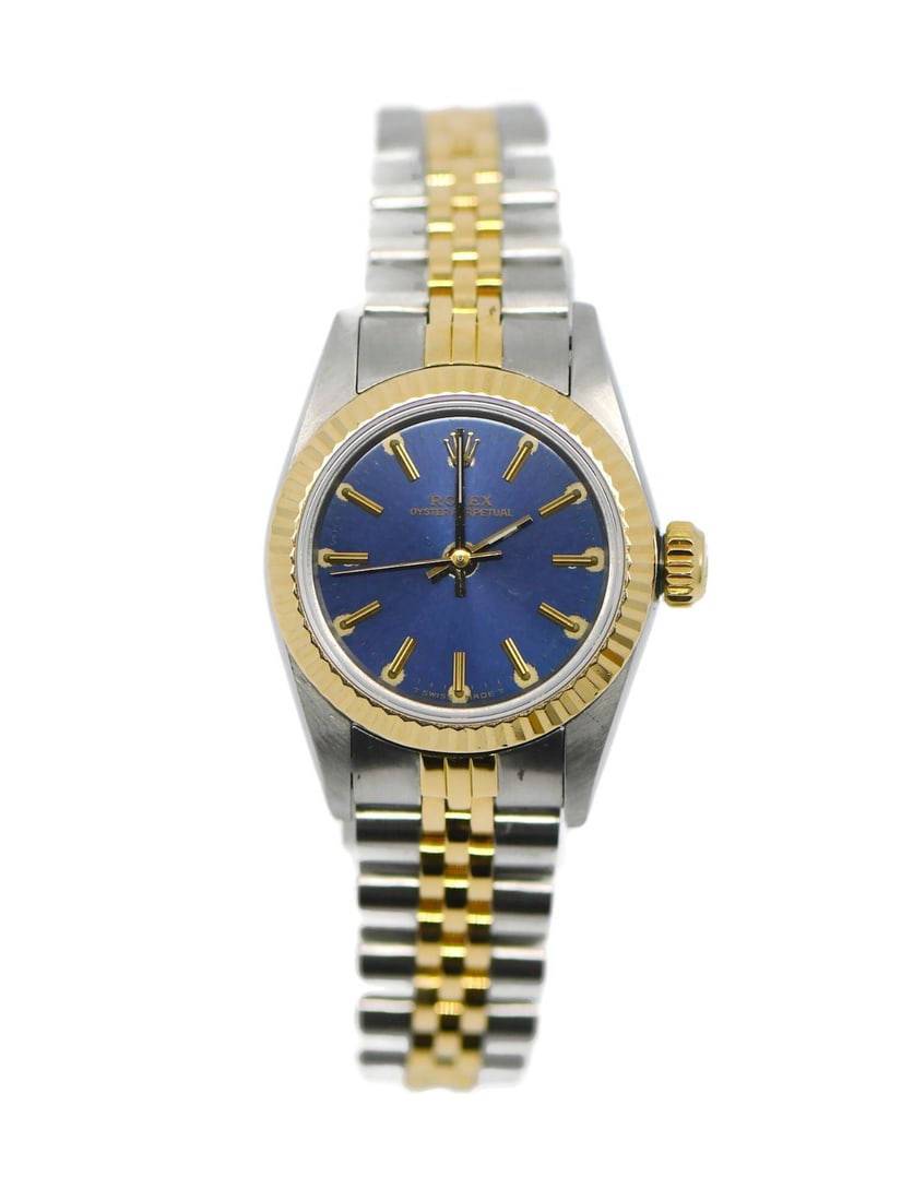Rolex Women's 1988 Oyster Perpetual 18K Gold Stainless Steel Wristwatch Ref 67193 Blue Dial: Rolex Women's 1988 Oyster Perpetual 18K Gold Stainless Steel Wristwatch Ref 67193 Blue Dial This Rolex Oyster Perpetual wristwatch features a 24mm stainless steel case with a fluted gold bezel and a b