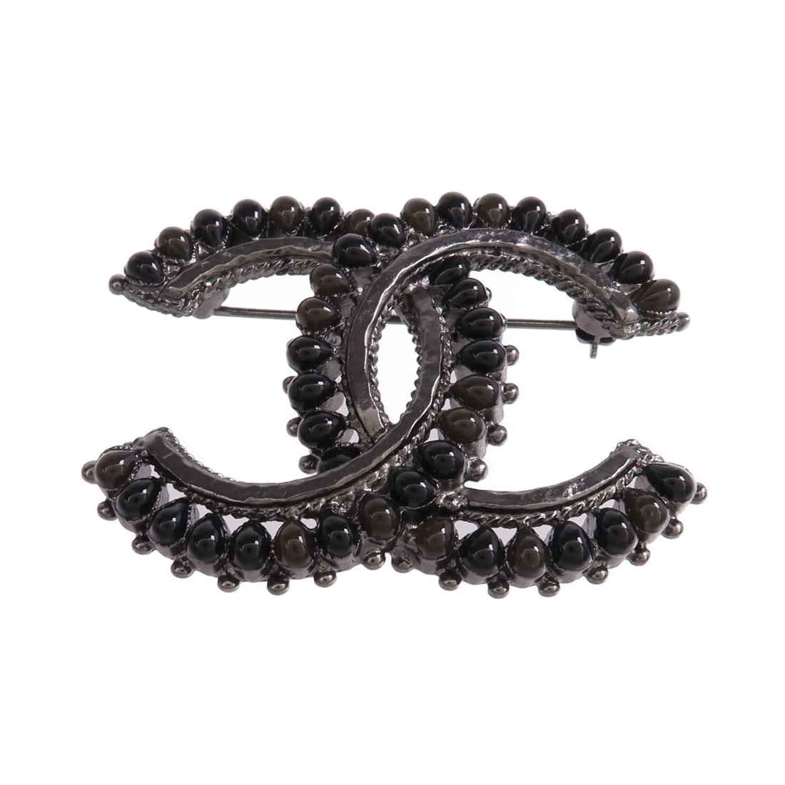 Metal CC Brooch in Black and Silver by CHANEL: Metal CC Brooch in Black and Silver by CHANEL CHANEL CC brooch in metal with a silver and black color combination. It measures 40 mm x 54 mm and is in very good AB condition. Accessories are not inclu