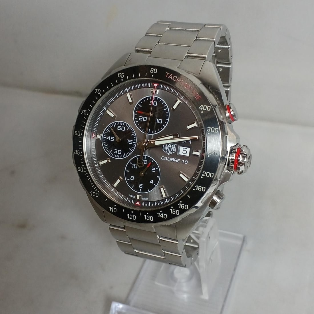 TAG Heuer CAZ2012-0 Formula 1 Caliber 16 mens automatic wristwatch: TAG Heuer CAZ2012-0 Formula 1 Caliber 16 mens automatic wristwatch Pre-owned TAG Heuer Formula 1 Caliber 16 automatic men's wristwatch, model CAZ2012-0, made in Switzerland. It is rated Product Rank B