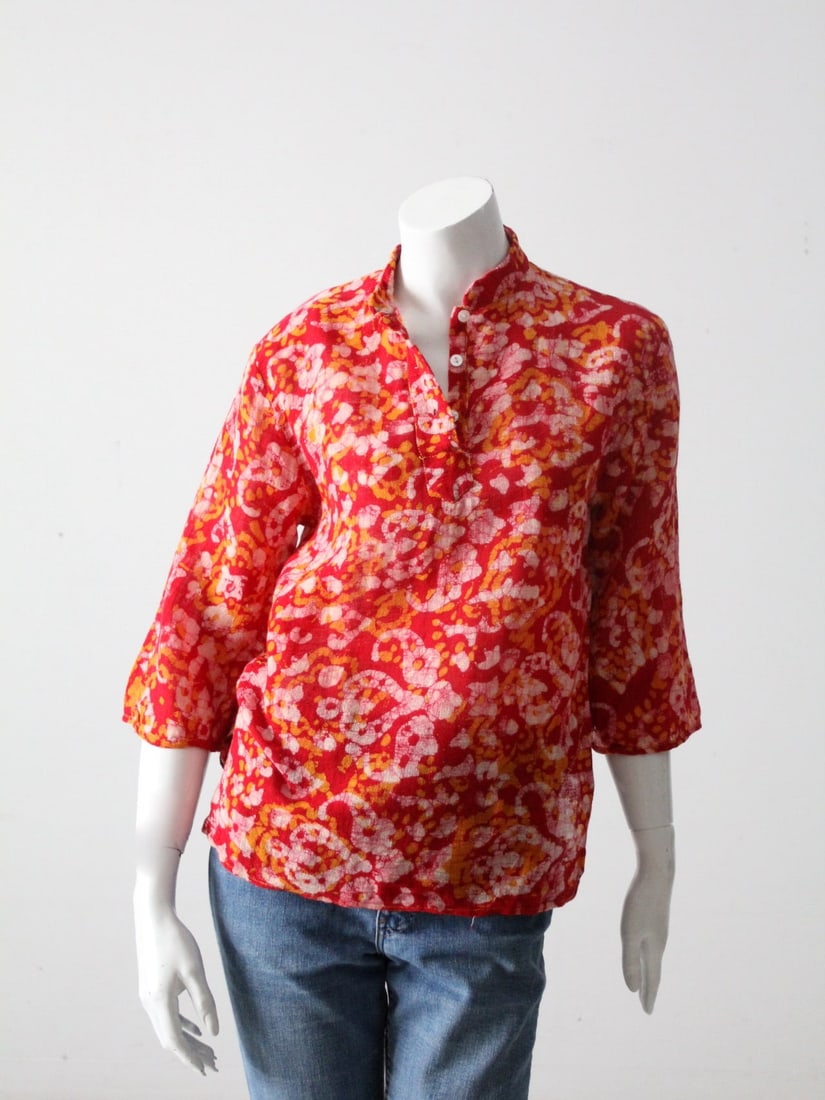 1970s Vintage India Cotton Boho Shirt Red with Gold Print: 1970s Vintage India Cotton Boho Shirt Red with Gold Print Embrace retro charm with this authentic 1970s vintage India cotton boho shirt. Crafted from semi-sheer red cotton, the top showcases a beautif