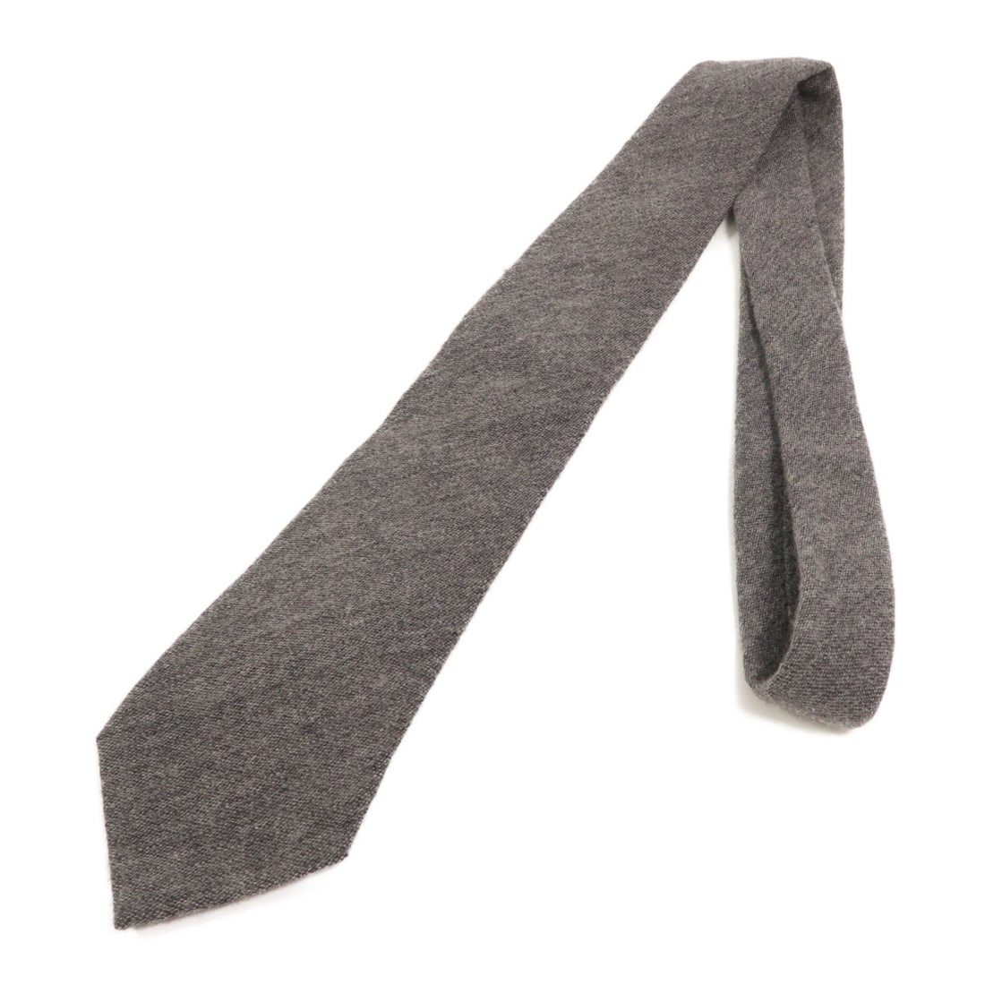 Grey Silk Wool Tie by ARMANI: Grey Silk Wool Tie by ARMANI Armani necktie in gray, made from silk and wool. The tie measures 154 cm in total length and 8 cm at the tip. It is offered in reasonable worn condition. Specifications Br