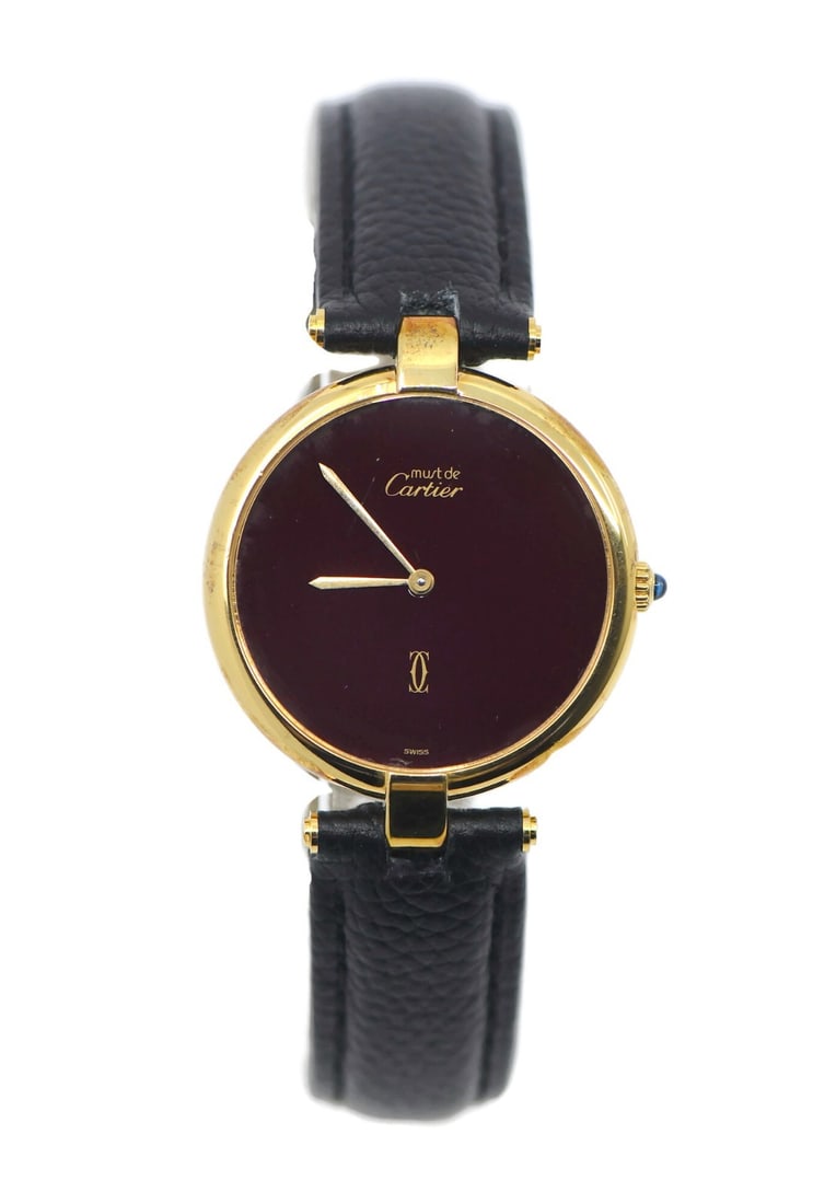 Cartier Vendome Quartz Leather Strap Red Dial Wristwatch: Cartier Vendome Quartz Leather Strap Red Dial Wristwatch This Cartier Must Vendome wristwatch features a 30mm sterling silver case paired with a red dial and analog display. It is powered by a reliabl