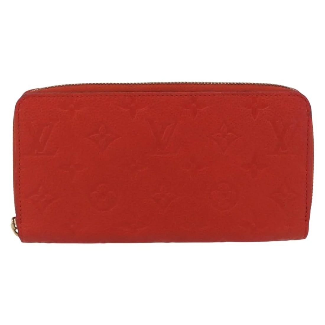 Orange Leather Zippy Wallet by Louis Vuitton Portefeuille Monogram Empreinte: Orange Leather Zippy Wallet by Louis Vuitton Portefeuille Monogram Empreinte The Louis Vuitton Portefeuille Zippy Monogramme Empreinte is a unisex wallet crafted from orange leather. It features a zip