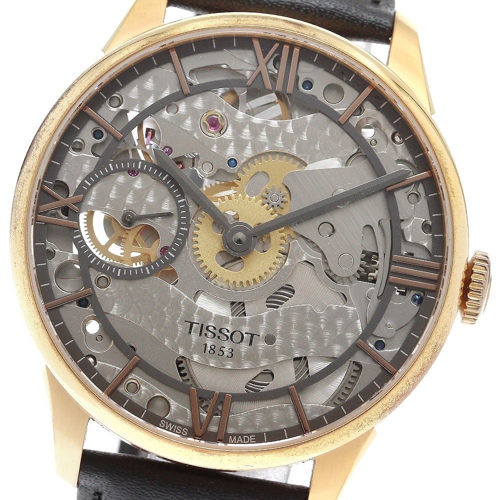 Tissot T-Classic Chemin des Tourelles Manual Wind Skeleton Dial Watch: Tissot T-Classic Chemin des Tourelles Manual Wind Skeleton Dial Watch This TISSOT T-Classic Chemin des Tourelles men's wristwatch features a stainless steel and gold-plated case with a skeleton dial, 