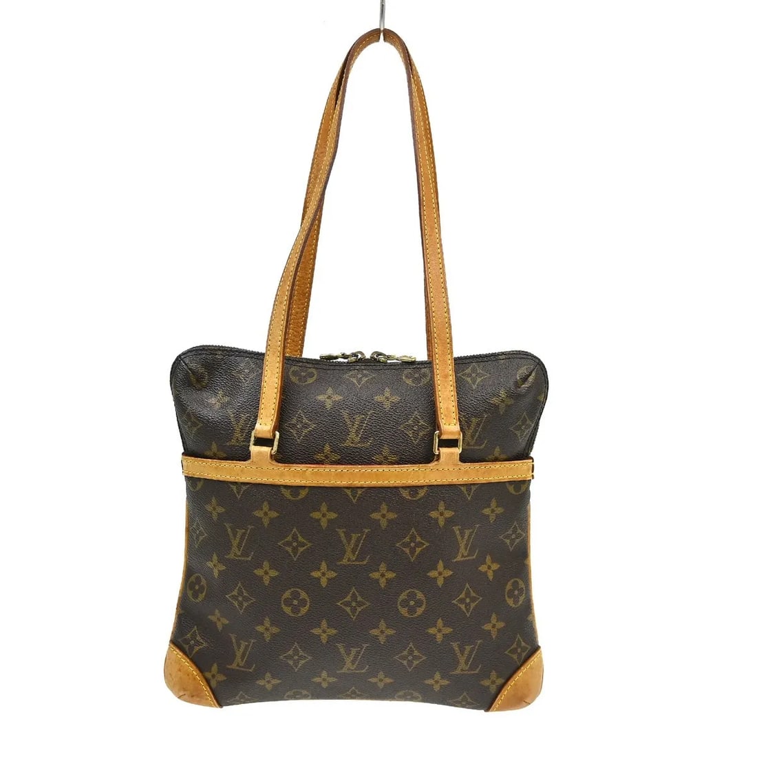 Louis Vuitton Vintage Coussin Brown Canvas Handbag: Louis Vuitton Vintage Coussin Brown Canvas Handbag Vintage Coussin bag in monogram canvas with a brown finish. Made in France, this piece is presented in good condition with visible wear consistent wi