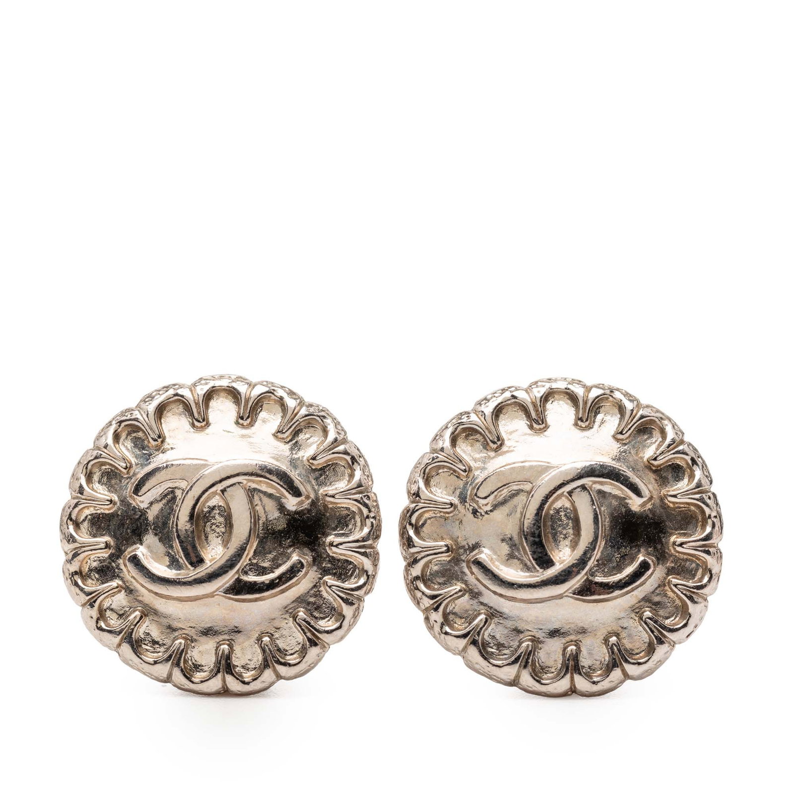 Chanel CC Silver Tone Clip On Earrings: Chanel CC Silver Tone Clip On Earrings These Chanel CC clip-on earrings feature a silver-tone metal construction with the iconic CC logo design. Made in France, they are designed for non-pierced ears 