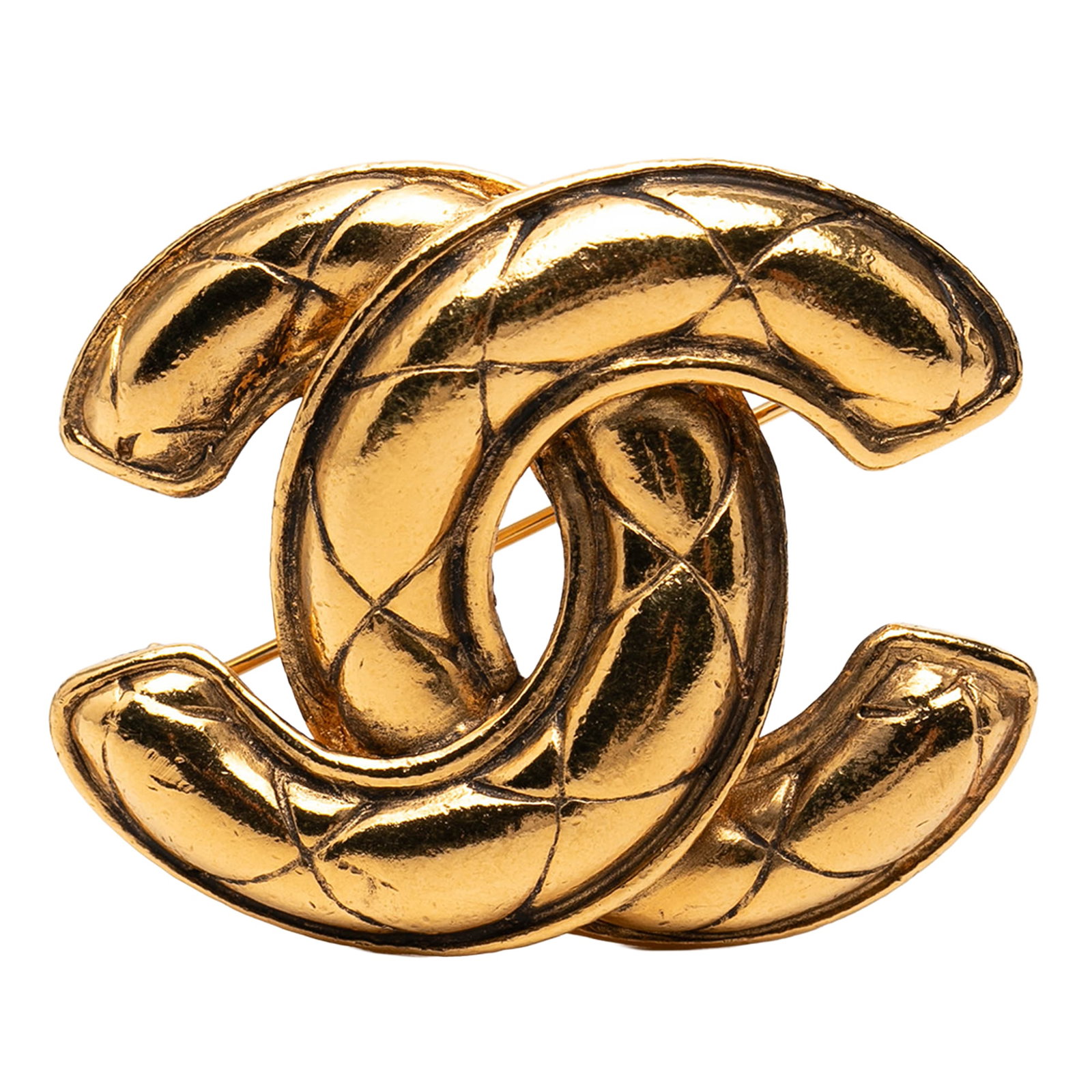 Chanel CC Quilted Gold Tone Metal Brooch: Chanel CC Quilted Gold Tone Metal Brooch Gold tone metal brooch with a back pin closure. It is identified as the Chanel CC Gold Plated Quilted Brooch and is made in France. The piece is categorized as
