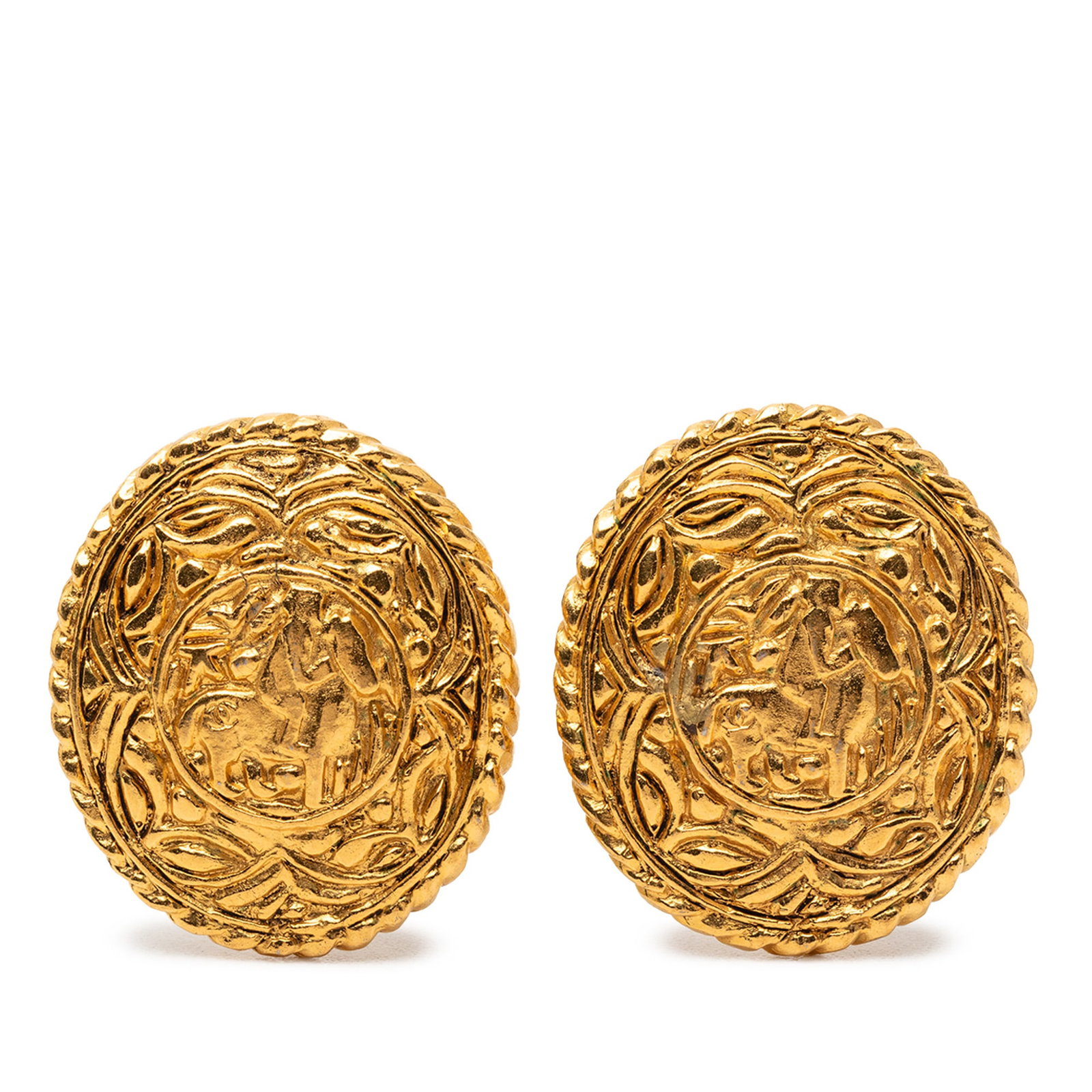 Chanel gold tone clip on horse medallion earrings: Chanel gold tone clip on horse medallion earrings These Chanel clip-on earrings feature gold tone metal bodies with a distinctive horse medallion design. Crafted in France, they are categorized as cos