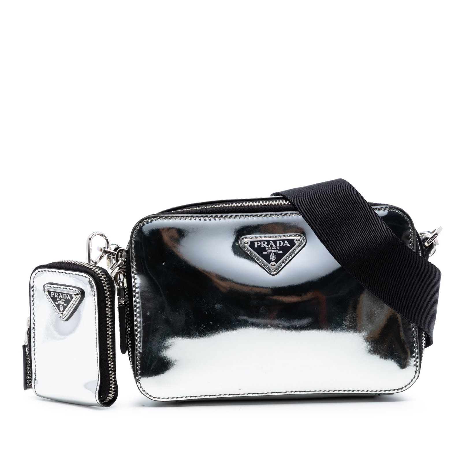 Prada Spazzolato Brique Silver Leather Crossbody Bag: Prada Spazzolato Brique Silver Leather Crossbody Bag This Prada Small Spazzolato Brique Crossbody bag is crafted from patent leather in a striking silver color. It features an adjustable and detachabl