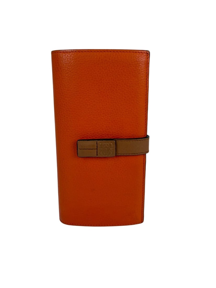 Loewe Orange Grained Calfskin Zip Around Wallet: Loewe Orange Grained Calfskin Zip Around Wallet This Loewe vertical wallet is crafted from grained calfskin leather in a vibrant orange hue, featuring a solid pattern and the brand's signature logo ac