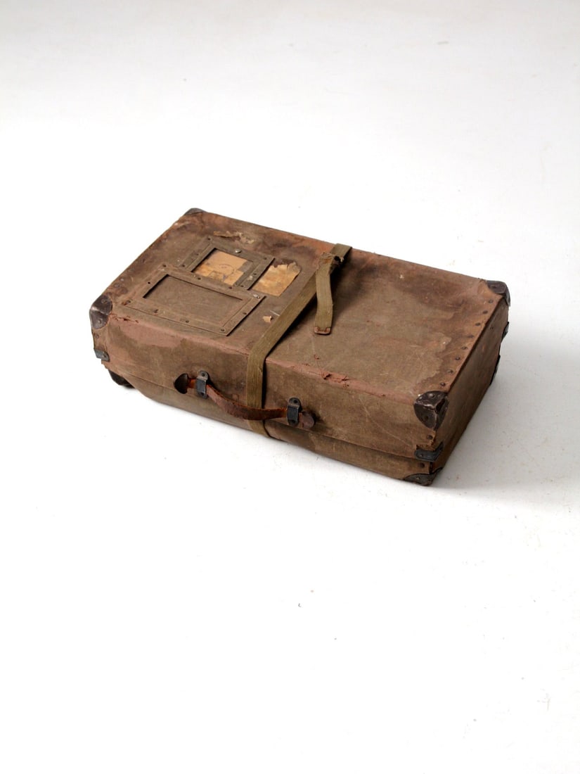 Vintage 1950s Army Laundry Mailer Box with Canvas Strap and Leather Handle: Vintage 1950s Army Laundry Mailer Box with Canvas Strap and Leather Handle This vintage army laundry mailer box from the 1950s adds a touch of history to your home. Crafted from durable fiberboard wit