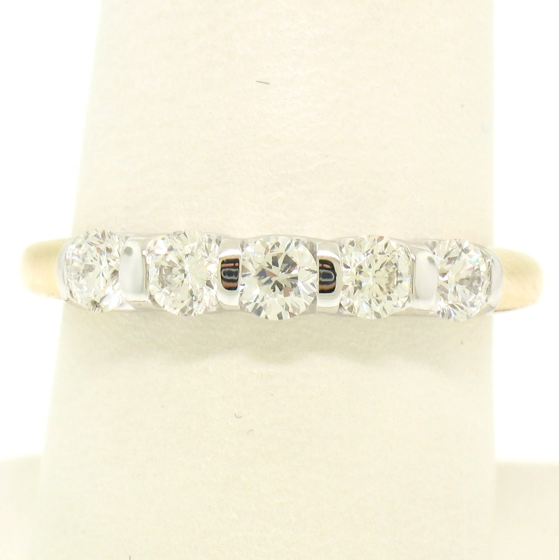 14k Two Tone Gold 1.0ctw VS1 Round Brilliant Diamond Band Ring: 14k Two Tone Gold 1.0ctw VS1 Round Brilliant Diamond Band Ring This exquisite band ring is crafted in solid 14k yellow and white gold, showcasing five beautiful round brilliant cut diamonds. Each diam