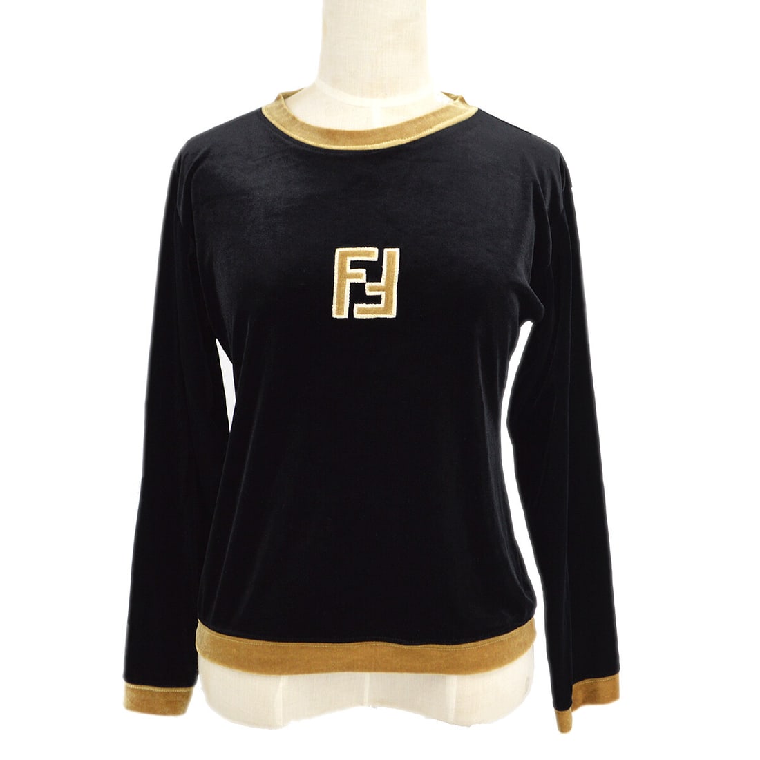 Fendi logo print women's long sleeve polyester top in black and gold: Fendi logo print women's long sleeve polyester top in black and gold Fendi women's long sleeve top in black and gold with logo detailing on the front. Made in Italy, this casual top is crafted from 10