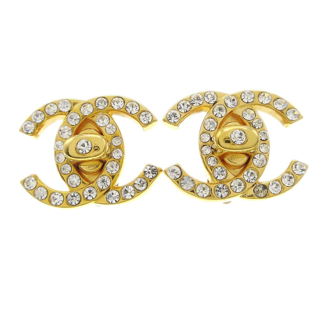 Chanel 96A Gold Plated Clip On Turnlock Rhinestone Earrings: Chanel 96A Gold Plated Clip On Turnlock Rhinestone Earrings Small Chanel clip-on earrings featuring the CC turnlock motif with rhinestone accents. Made in France, these gold-plated earrings are marked
