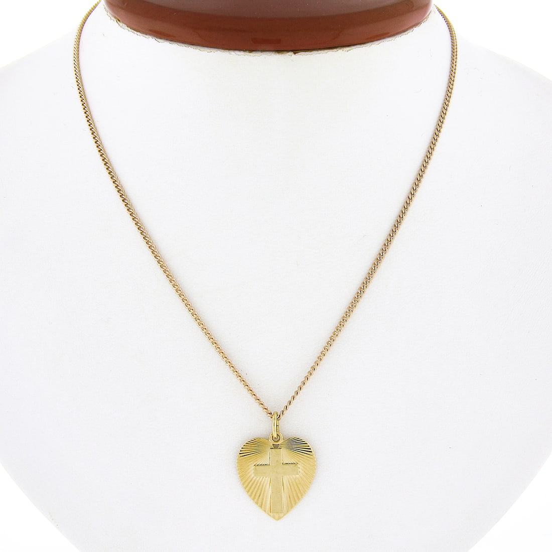 14k Yellow Gold Heart Cross Pendant Necklace 16.5 Inch Curb Chain: 14k Yellow Gold Heart Cross Pendant Necklace 16.5 Inch Curb Chain This vintage necklace features a solid 14k yellow gold heart-shaped pendant with a fluted finish, adorned at the center with a polishe