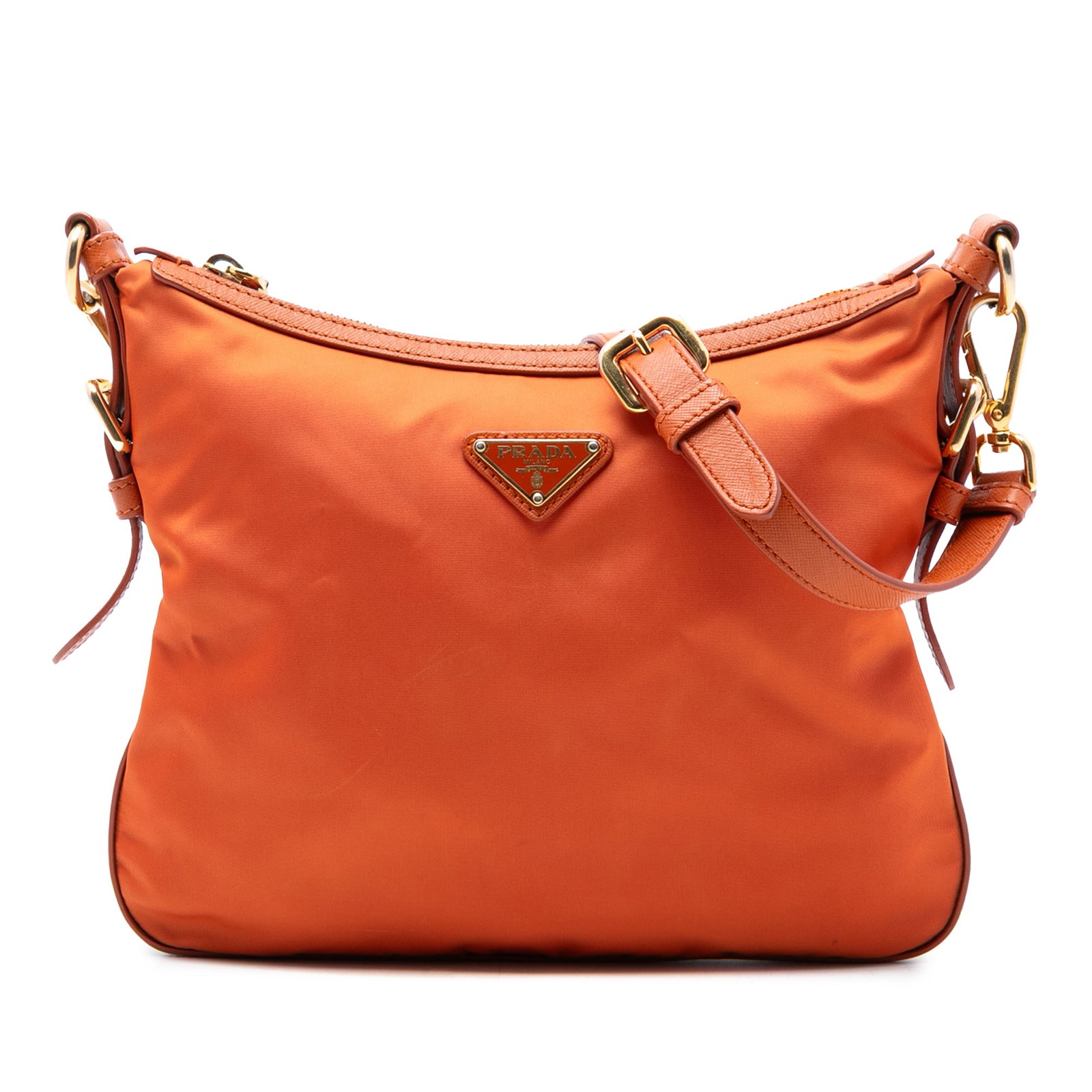 Prada Tessuto Crossbody Bag with Saffiano Leather Trim Orange: Prada Tessuto Crossbody Bag with Saffiano Leather Trim Orange This Prada crossbody bag features a durable nylon body accented with saffiano leather trim. It is designed with an adjustable and detachab