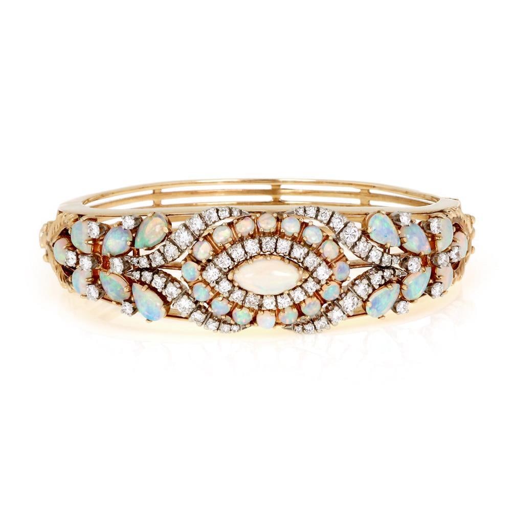 Vintage 14k Yellow Gold Floral Bracelet with Diamonds and Opals: Vintage 14k Yellow Gold Floral Bracelet with Diamonds and Opals This exquisite vintage bracelet is crafted from 14k yellow gold, showcasing a stunning wide dome shape adorned with fiery opals and spar
